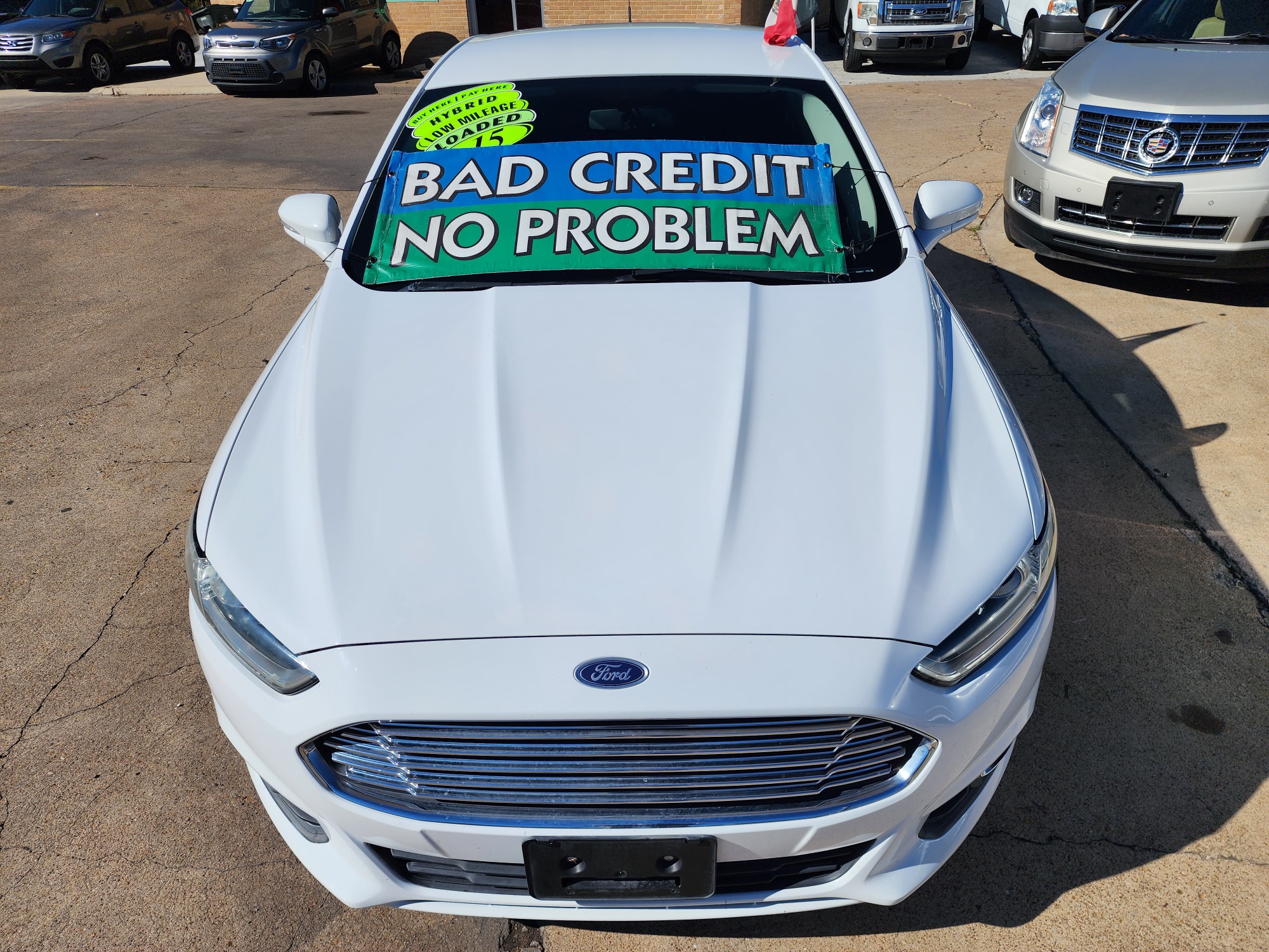 2015 WHITE Ford Fusion Hybrid S (3FA6P0UU3FR) with an 2.0L L4 DOHC 16V HYBRID engine, CVT transmission, located at 2660 S.Garland Avenue, Garland, TX, 75041, (469) 298-3118, 32.885387, -96.656776 - Welcome to DallasAutos4Less, one of the Premier BUY HERE PAY HERE Dealers in the North Dallas Area. We specialize in financing to people with NO CREDIT or BAD CREDIT. We need proof of income, proof of residence, and a ID. Come buy your new car from us today!! This is a 2015 FORD FUSION HYBRID S L - Photo #8
